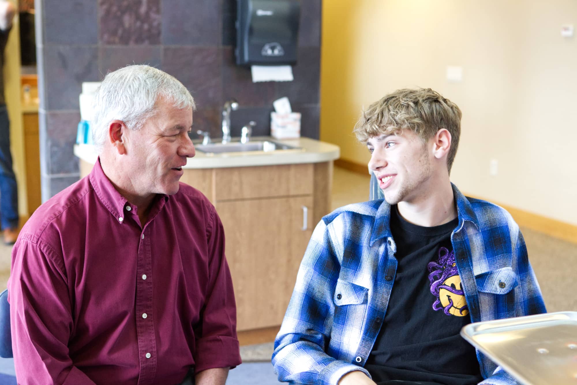 Orthodontist talking with patient about Billings braces